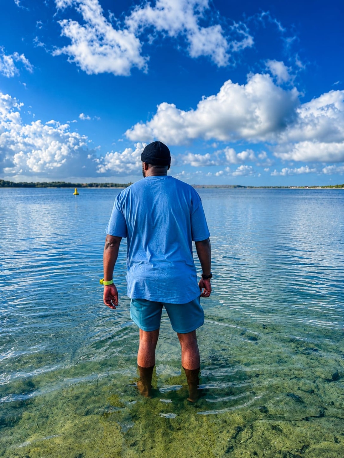 Traveller standing in clear water